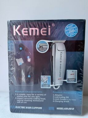 Kemei KM-2812 professional hair clipper, featuring a silver stainless steel blad
